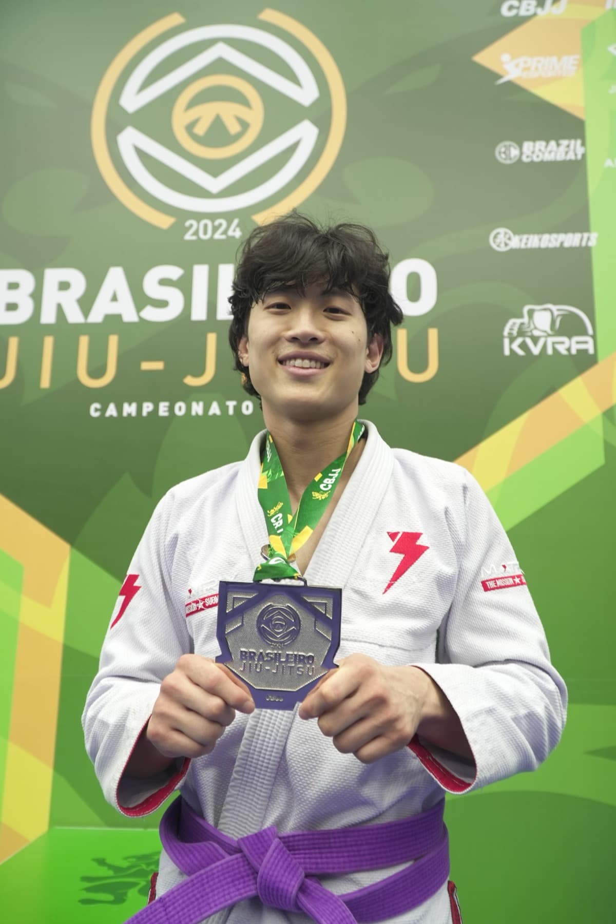 Mithly's founder on the podium at the 2024 Brasileiro de Jiu-Jitsu, medal in hand